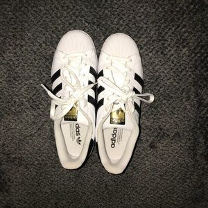 Adidas black and white superstar sneakers